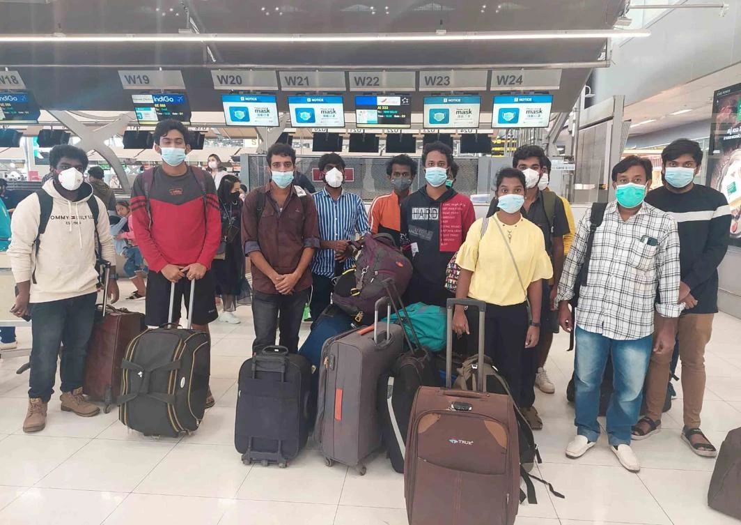 Rescued Indian workers lured by agents for fake job opportunities in the information technology sector overseas arrive at the airport in Chennai, India. (Ministry of External Affairs via AP)