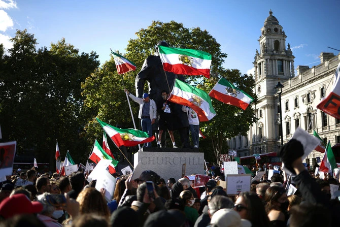People demonstrate outside the Houses of Parliament in London on October 8, 2022, to protest the death of Mahsa Amini in the hands of Tehran's religious police. (Reuters)