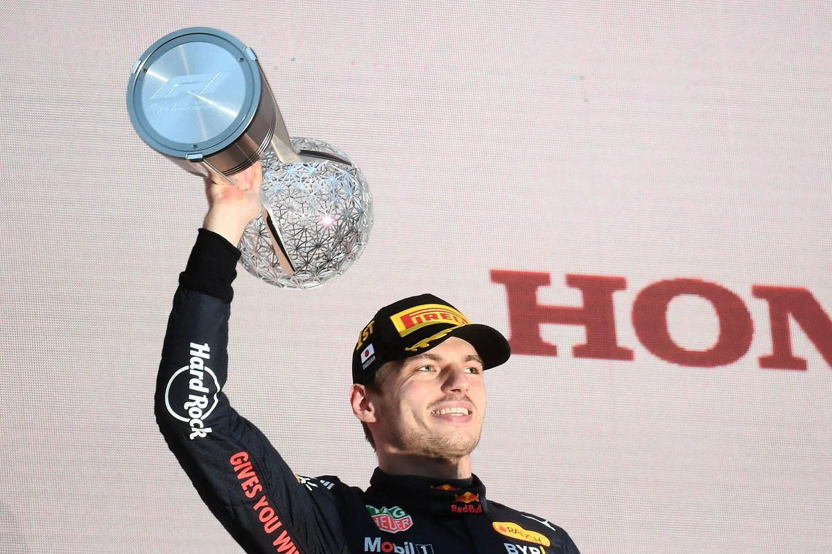 Red Bull Racing's Dutch driver Max Verstappen on the podium with the trophy following his victory at the Formula One Japanese Grand Prix at Suzuka. (AFP)