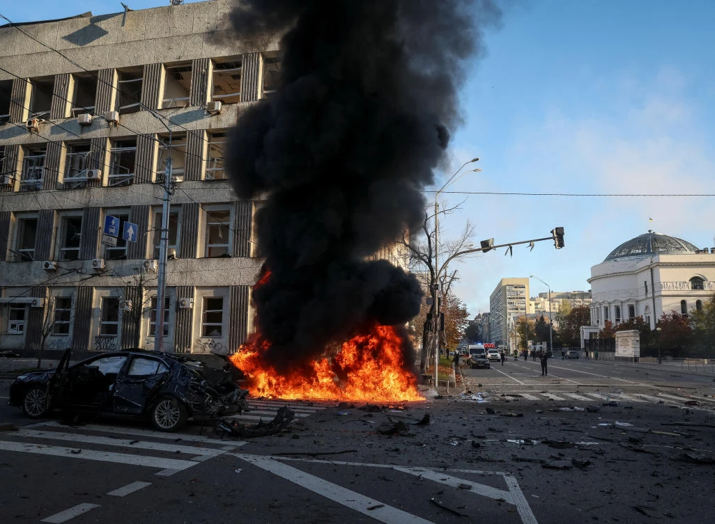 Cars burn after Russian military strike, as Russia's invasion of Ukraine continues, in central Kyiv, Ukraine October 10, 2022. (Reuters)