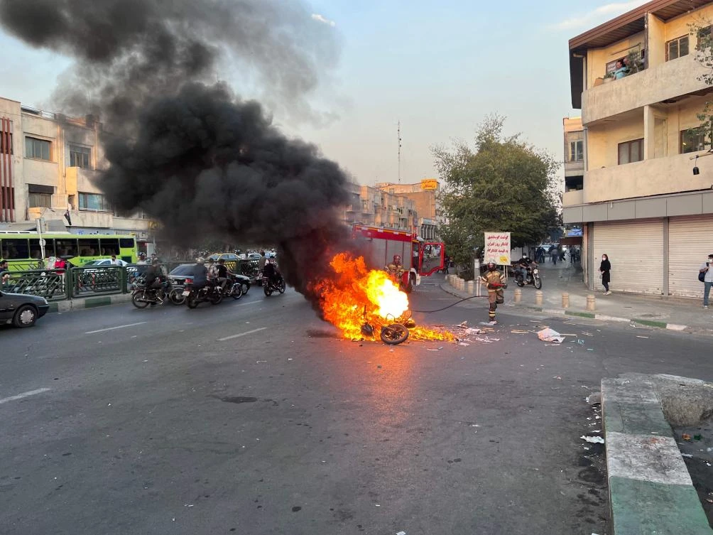 Firefighters arrive to extinguish a motorcycle on fire in the capital Tehran. (File/AFP)