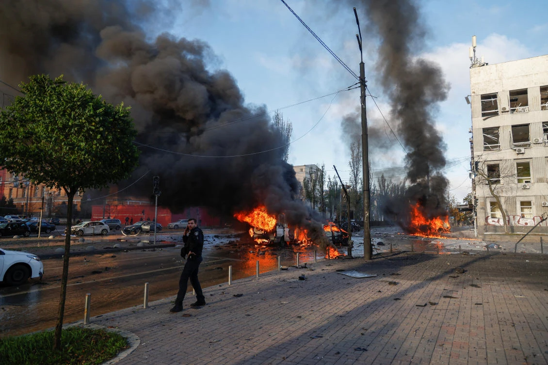 Cars are seen on fire after Russian missile strikes, as Russia's attack continues, in Kyiv, Ukraine October 10, 2022. (Reuters)