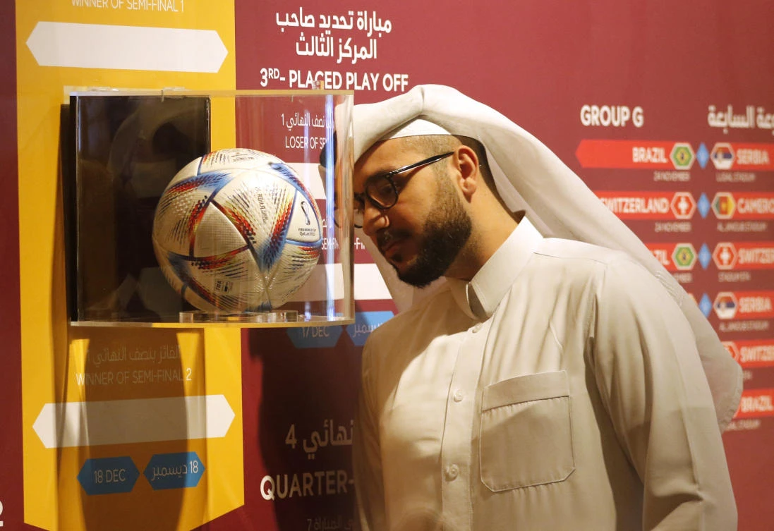 A man looks at a FIFA World Cup Qatar 2022 football at the 3-2-1 Qatar Olympic and Sports Museum on Monday. (Reuters)