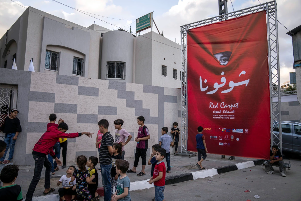 Palestinians attend the opening ceremony for the Sixth annual Red Carpet Human Rights Film Festival in Gaza City on Oct. 13, 2022. (AP Photo/Fatima Shbair)