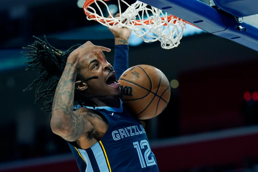 Memphis Grizzlies guard Ja Morant dunks during the second half of an NBA preseason basketball game against the Detroit Pistons, Thursday in Detroit. (AP)