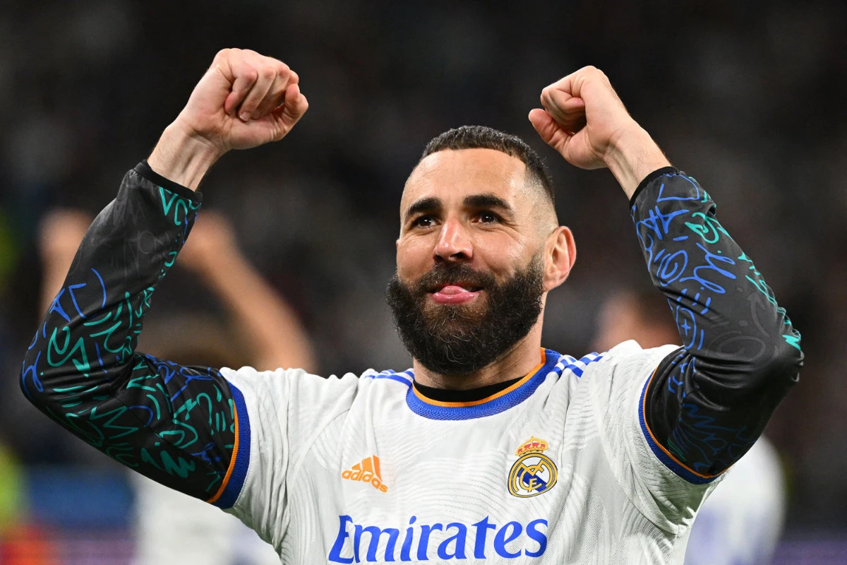 Real Madrid forward Karim Benzema celebrates at the end of the UEFA Champions League semi-final football match between Real Madrid CF and Manchester City in Madrid. (AFP)