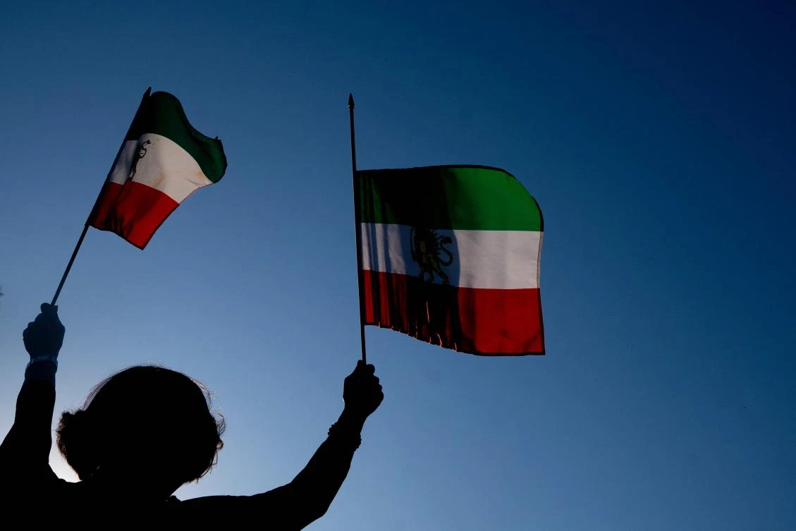 Demonstrators carry Iranian flags while marching during the "March of Solidarity for Iran" in Washington, DC, on October 15, 2022. (File/AFP)