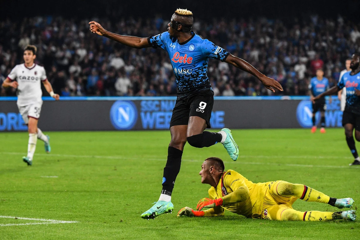 Napoli forward Victor Osimhen scores his side's third goal during their Italian Serie A football match against Bologna on Oct. 16, 2022 at the Diego-Maradona stadium in Naples. (AFP)