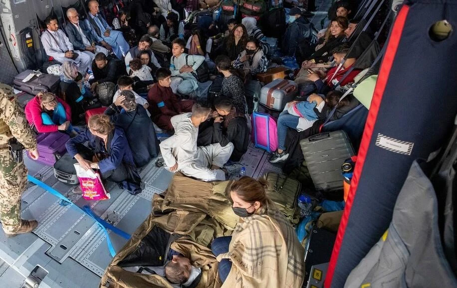 German citizens and Afghans who worked for Germany are evacuated from Kabul airport, Afghanistan, Aug. 2021. (AP Photo)