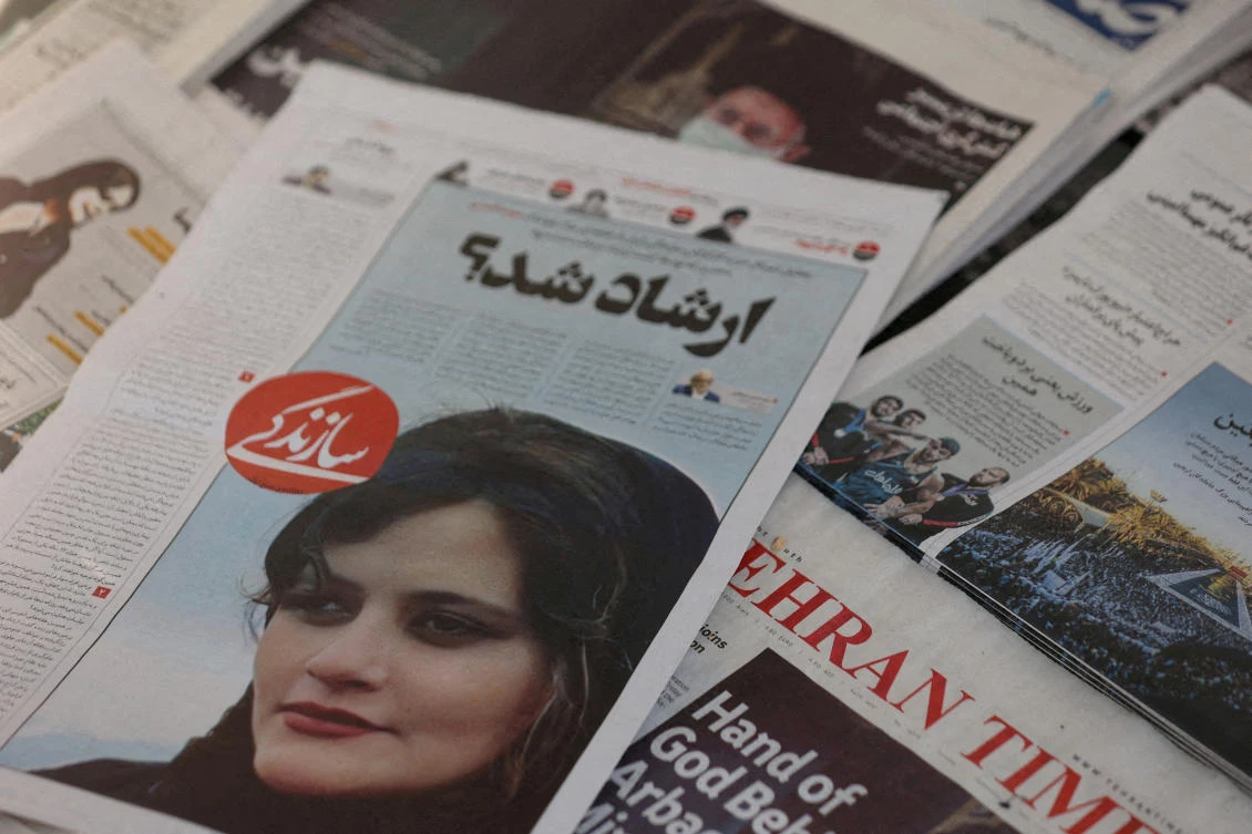 A newspaper with a cover picture of Mahsa Amini, a woman who died after being arrested by Iranian morality police is seen in Tehran, Iran, Sept. 18, 2022. (Reuters)