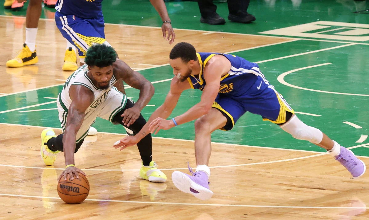 In this Jun 16, 2022 file photo, Boston Celtics guard Marcus Smart and Golden State Warriors guard Stephen Curry reach for a loose ball during the fourth quarter of Game 6 in the 2022 NBA Finals at the TD Garden. (Reuters)