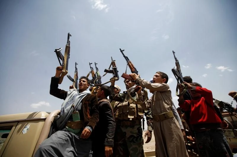 Houthi fighters react while riding on the back of a truck as they attend a tribal gathering in Sanaa, Yemen, July 16, 2016. (Reuters)