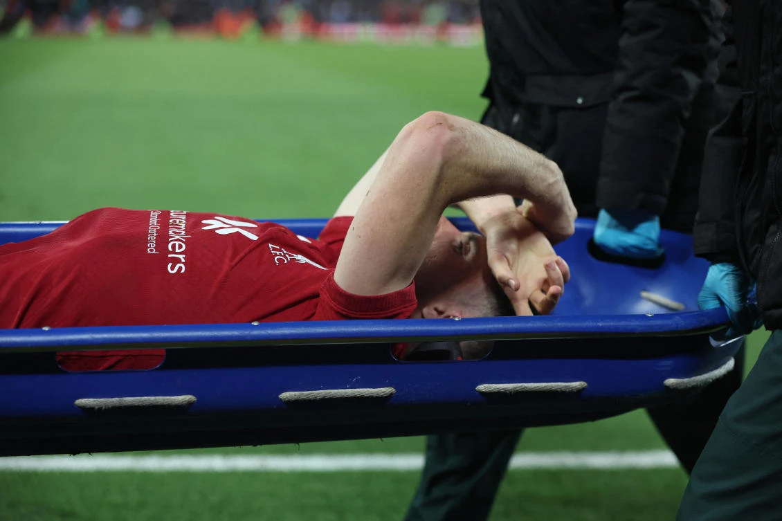 Liverpool’s Diogo Jota comes off the pitch in a stretcher after sustaining an injury during their Premier League match against Manchester City at Anfield on Sunday. (Reuters)