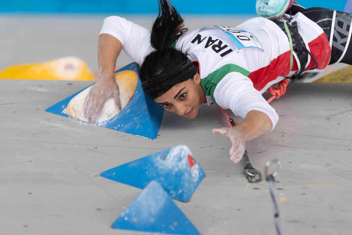 A handout picture provided by the International Federation of Sport Climbing (IFSC) shows Iranian climber Elnaz Rekabi competing during the women boulder finals of the Asian Championships of the IFSC in Seoul, South Korea. (AFP)