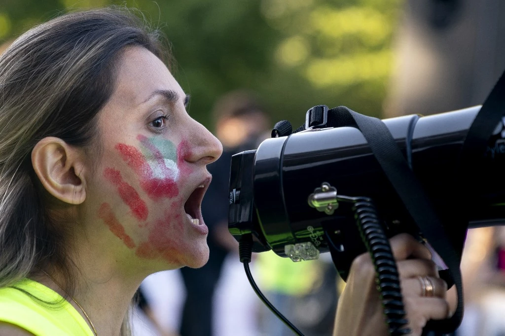 A demonstrator chants slogans during the "March of Solidarity for Iran" in Washington, DC, on October 15, 2022. (AFP)