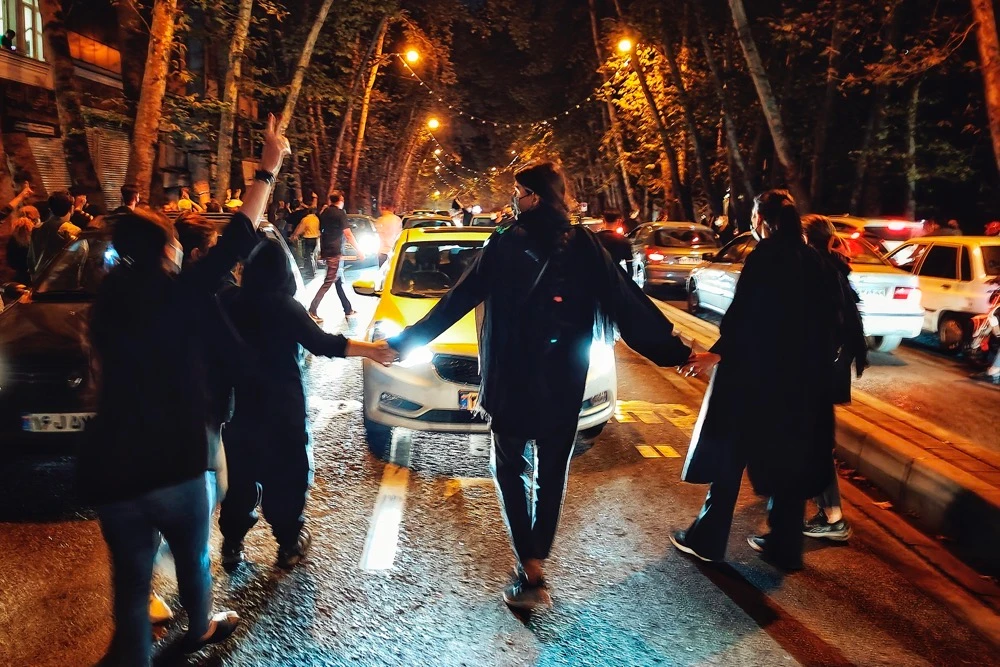 Iranians women protest a 22-year-old woman Mahsa Amini's death after she was detained by the morality police, in Tehran. (AP)