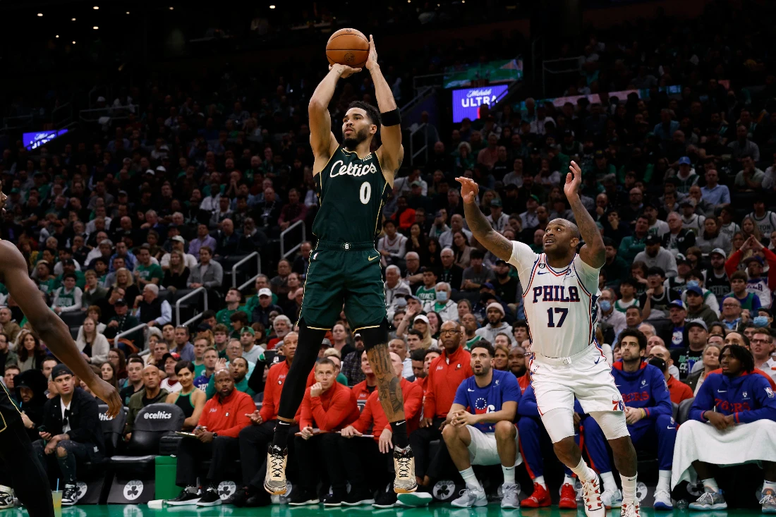 Boston Celtics forward Jayson Tatum shoots after going past Philadelphia 76ers forward P.J. Tucker during the third quarter of their NBA game at TD Garden on Tuesday. (Supplied)