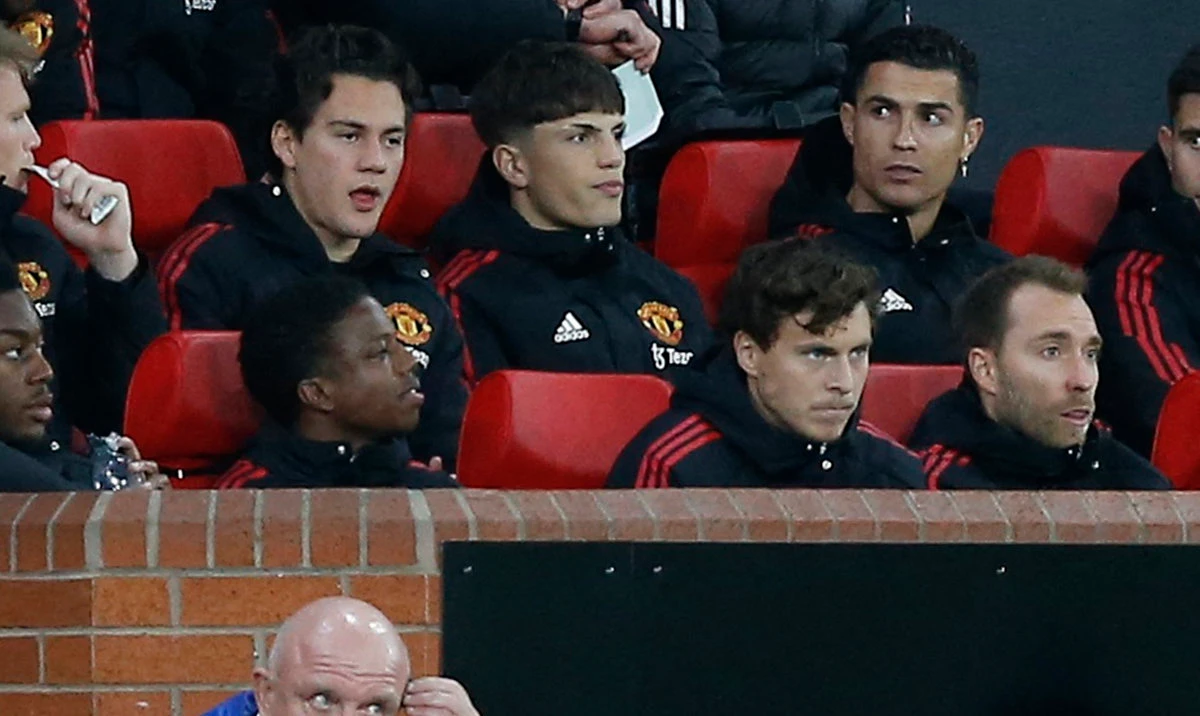 Manchester United's Cristiano Ronaldo with teammates on the substitutes bench ahead of the Premier League match against Tottenham on Wednesday. (Reuters)