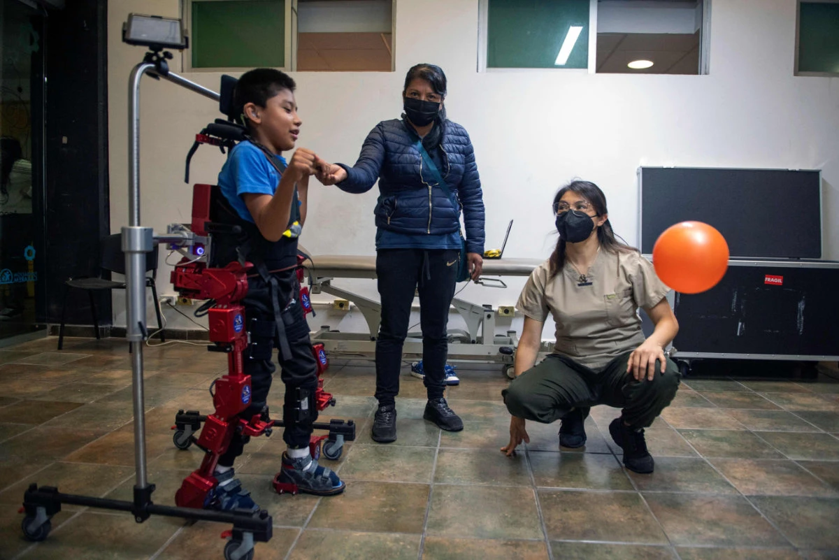 David Zabala, an 8-year-old boy with cerebral palsy, attends a rehabilitation session with the robotic exoskeleton Atlas 2030 in Mexico City on Oct. 18, 2022. (AFP)