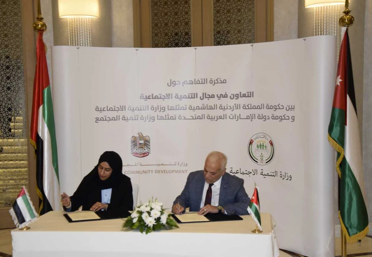 The UAE’s Community Development Minister Hessa bint Essa Buhumaid and Jordan’s Social Development Minister Ayman Mufleh signing the agreement. (Petra)