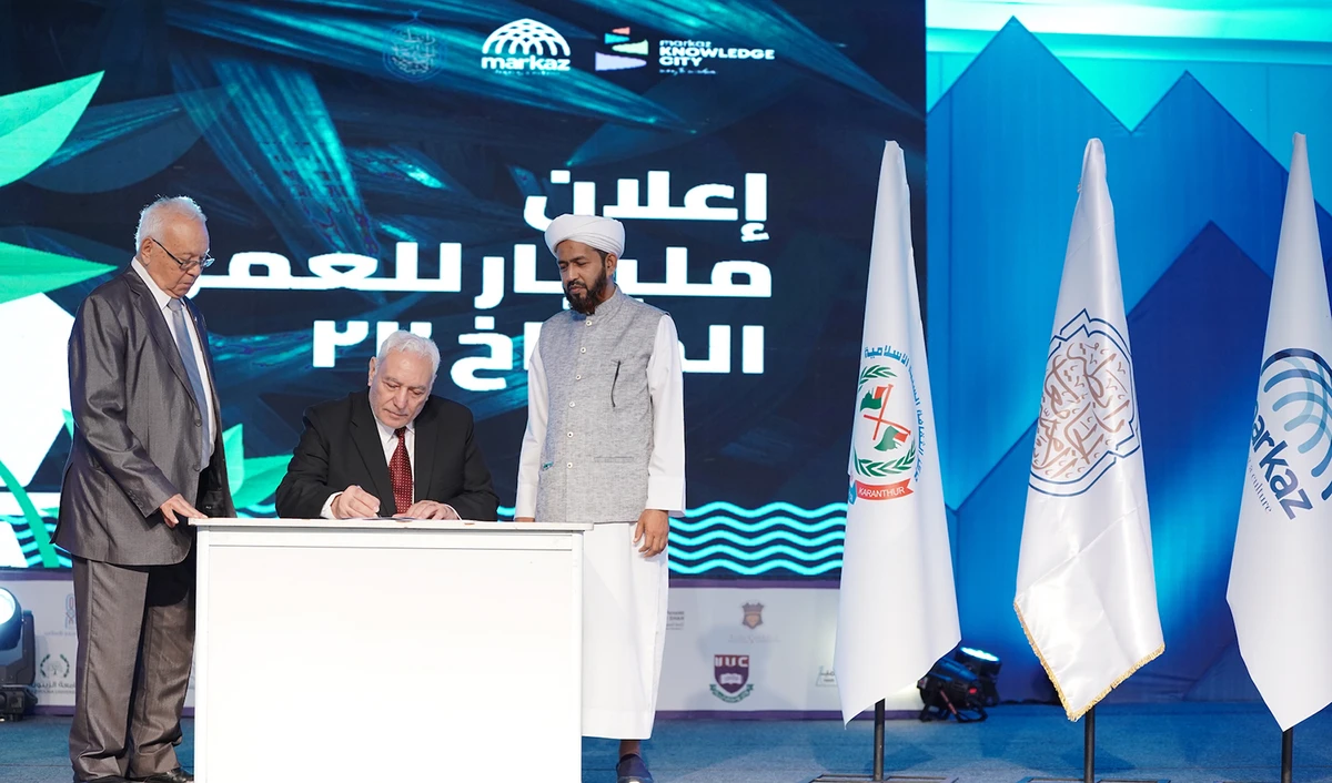 Caption: Dr. Osama Al-Abed, secretary general of the League of Islamic Universities, signs the Malabar Declaration on climate action in Kozhikode southern India, on Oct. 20, 2022. (Photo courtesy: League of Islamic Universities)