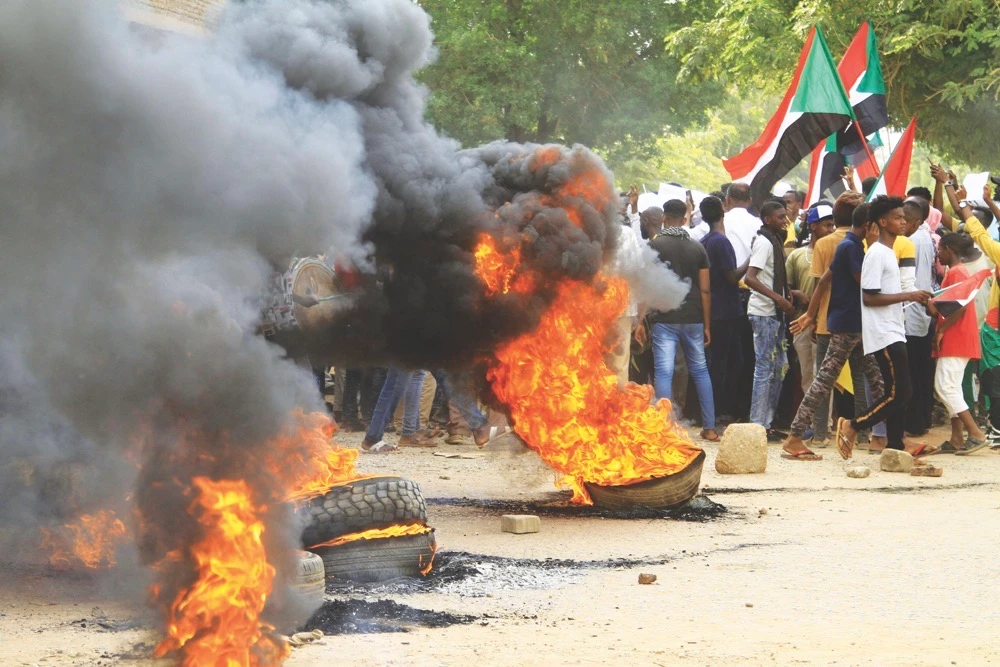Demonstrators took to the streets on Friday to renew protests nearly a year after a military coup derailed Sudan’s transition to democracy. (AFP)