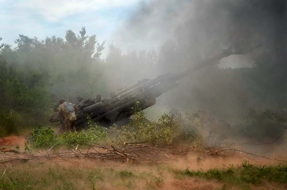 Ukrainian soldiers fire at Russian positions from a U.S.-supplied M777 howitzer in Ukraine's eastern Donetsk region. (AP/File Photo)