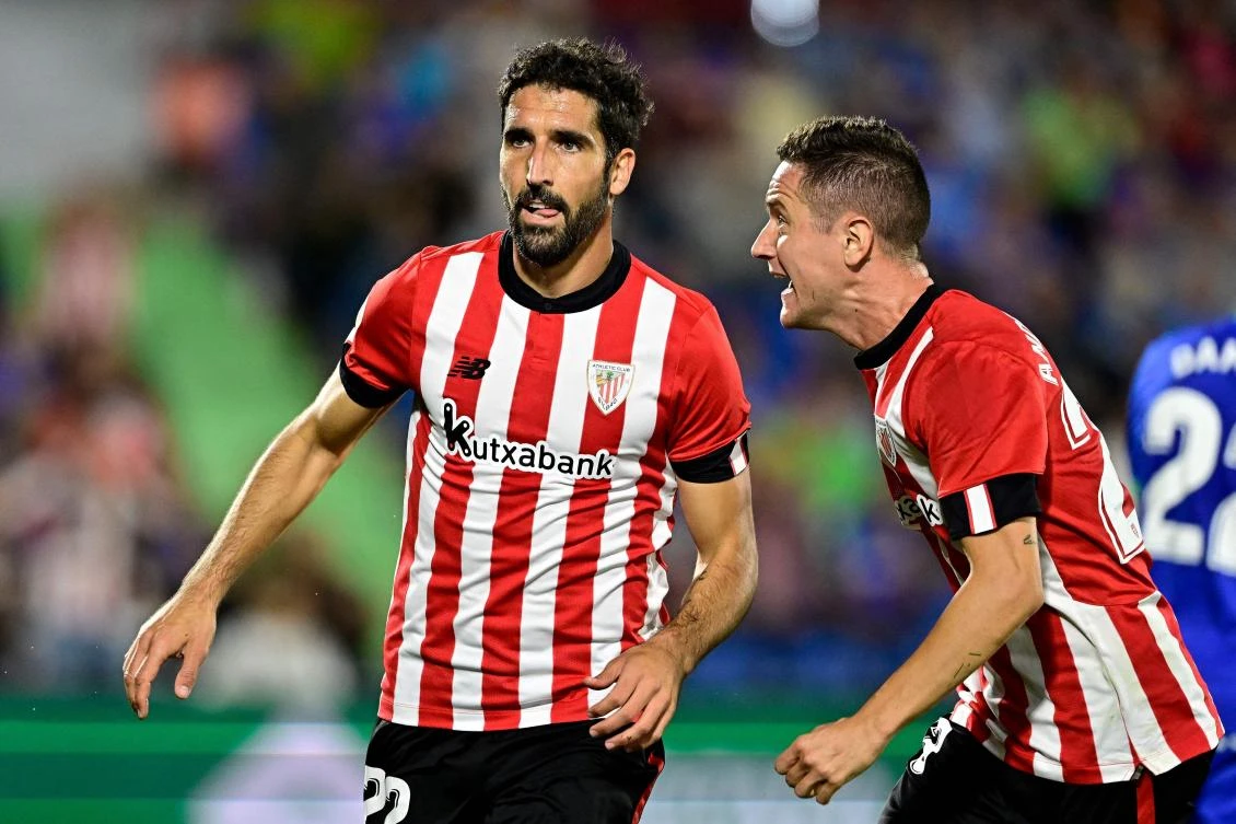 Athletic Bilbao’s Spanish midfielder Raul Garcia celebrates with teammates after scoring his team’s second goal during their match against Getafe CF at the Col. Alfonso Perez stadium in Getafe on October 18, 2022. (AFP)