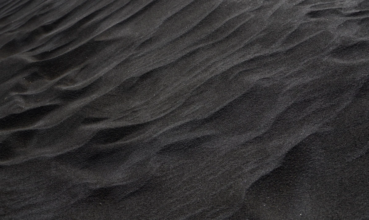 Black sand is rich in valuable minerals including ilmenite, zircon, magnetite, rutile and garnet. (Shutterstock)