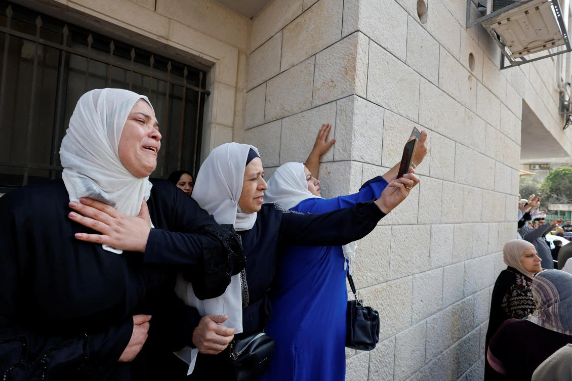 Mourners attend the funeral of Palestinian Den of Lions member Tamer Kilani, who was killed in an explosion, in Nablus in the Israeli-occupied West Bank. (Reuters)
