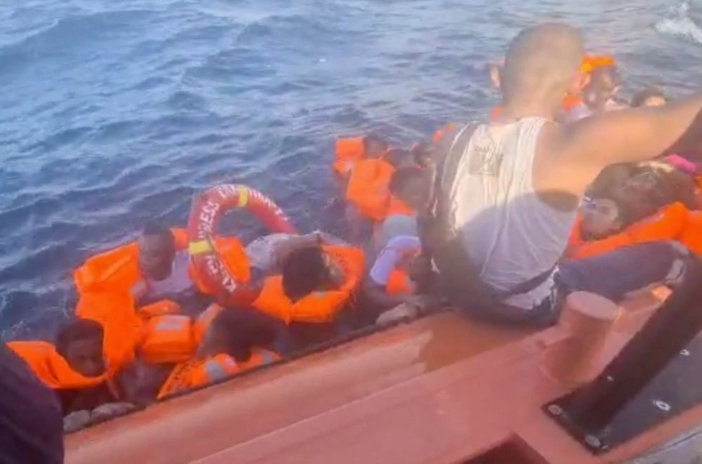 An Indonesian National Search and Rescue Agency (BASARNAS) screengrab shows survivors being rescued after their boat caught fire off Kupang, Indonesia, Oct. 24, 2022. (AP Photo)
