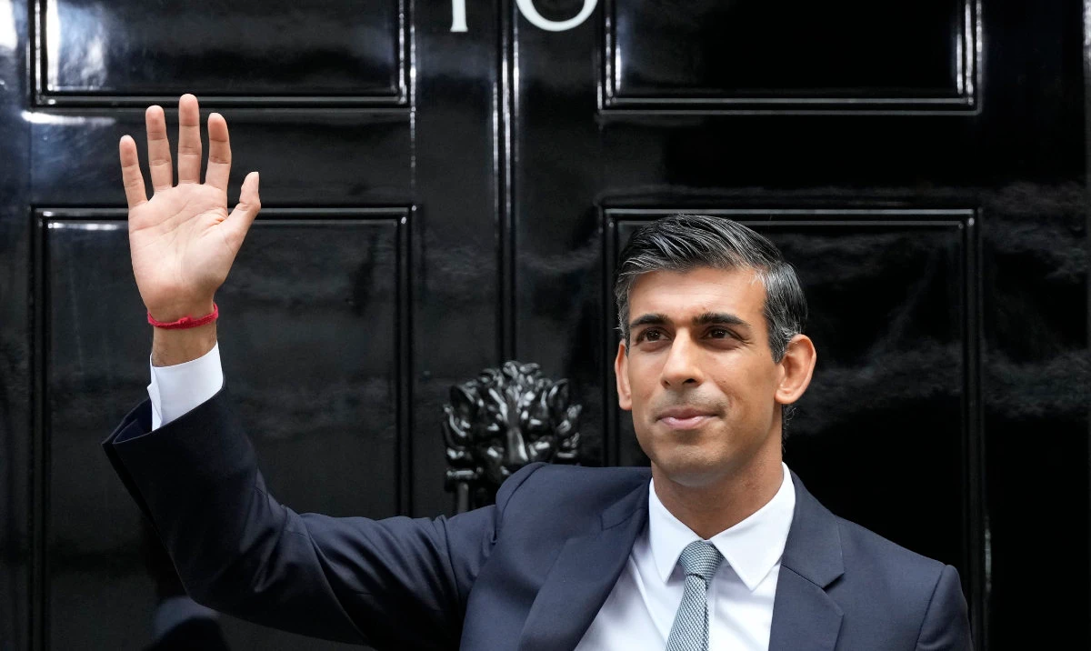 New British Prime Minister Rishi Sunak waves after arriving at Downing Street in London, Tuesday, Oct. 25, 2022. (AP)