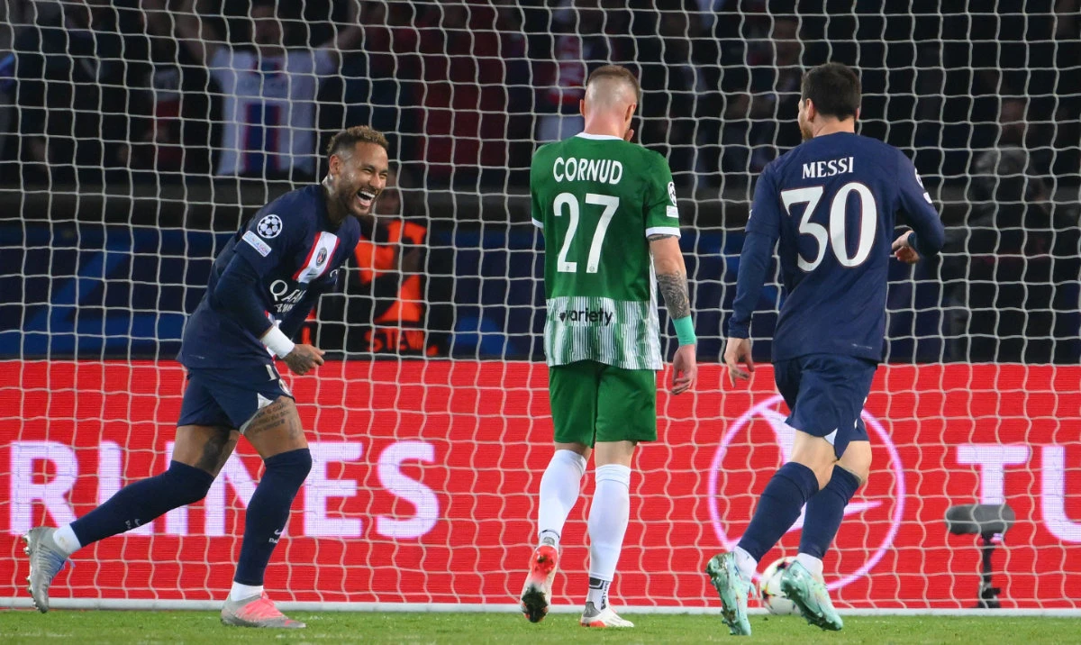 Paris Saint-Germain's Argentine forward Lionel Messi (R) celebrates with teammate Brazilian forward Neymar after scoring his team's fourth goal during the UEFA Champions League Group H match against Maccabi Haifa FC. (AFP)