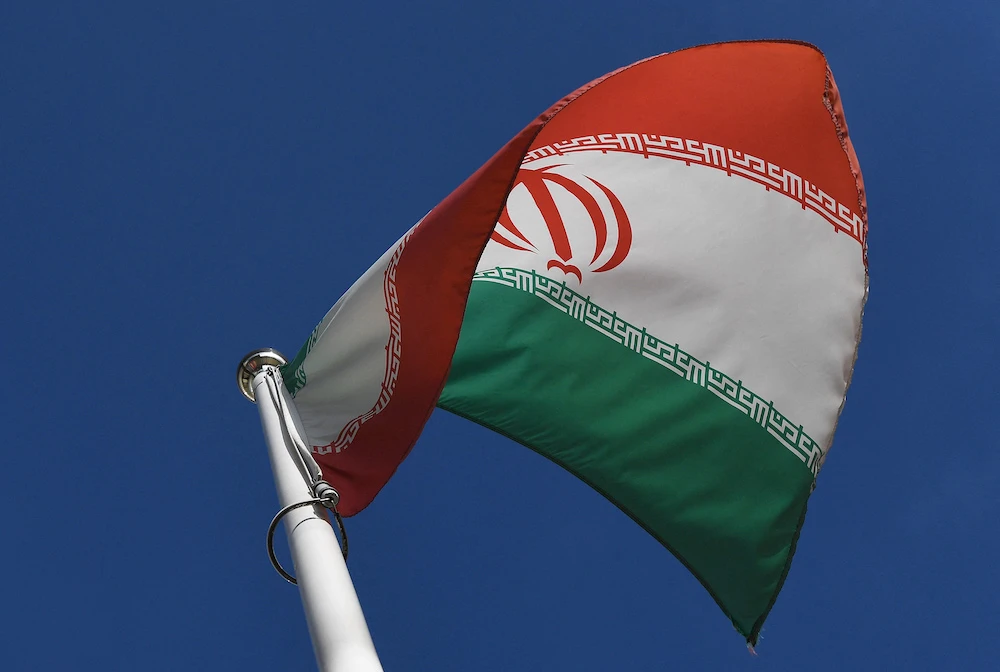 The Iranian national flag is seen outside the International Atomic Energy Agency (IAEA) headquarters during the agency’s Board of Governors meeting in Vienna. (File/AFP)