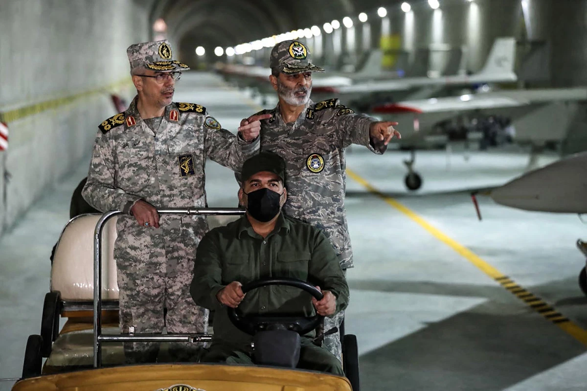 Iran's military commanders are shown visiting an underground drone base in Iran in this handout photo from the Iranian Army Office. (AFP file)