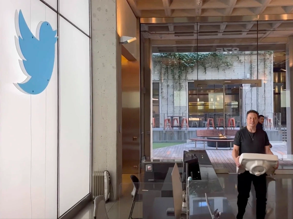 This image from the Twitter page of Elon Musk shows Musk entering Twitter headquarters in San Francisco, carrying a sink through the lobby area on Oct. 26, 2022. (AP)