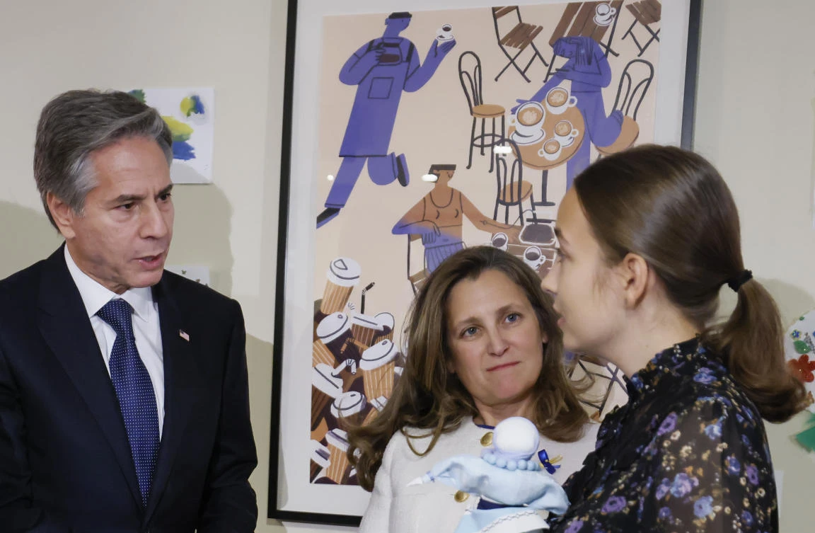 US Secretary of State Antony Blinken and Canada’s Deputy Prime Minister Chrystia Freeland meet with volunteers at Cafe Ukraine, on Thursday in Ottawa, Ontario. (AP)