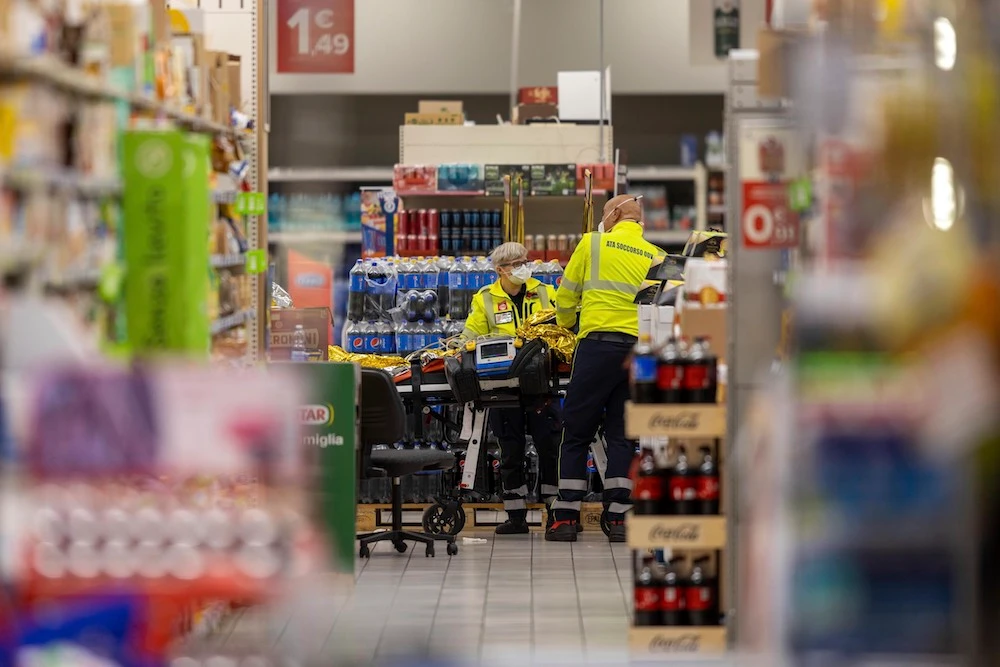 A man grabbed a knife from a supermarket shelf and stabbed six people Thursday inside a shopping center south of the Italian city of Milan, killing one person. (LaPresse via AP)