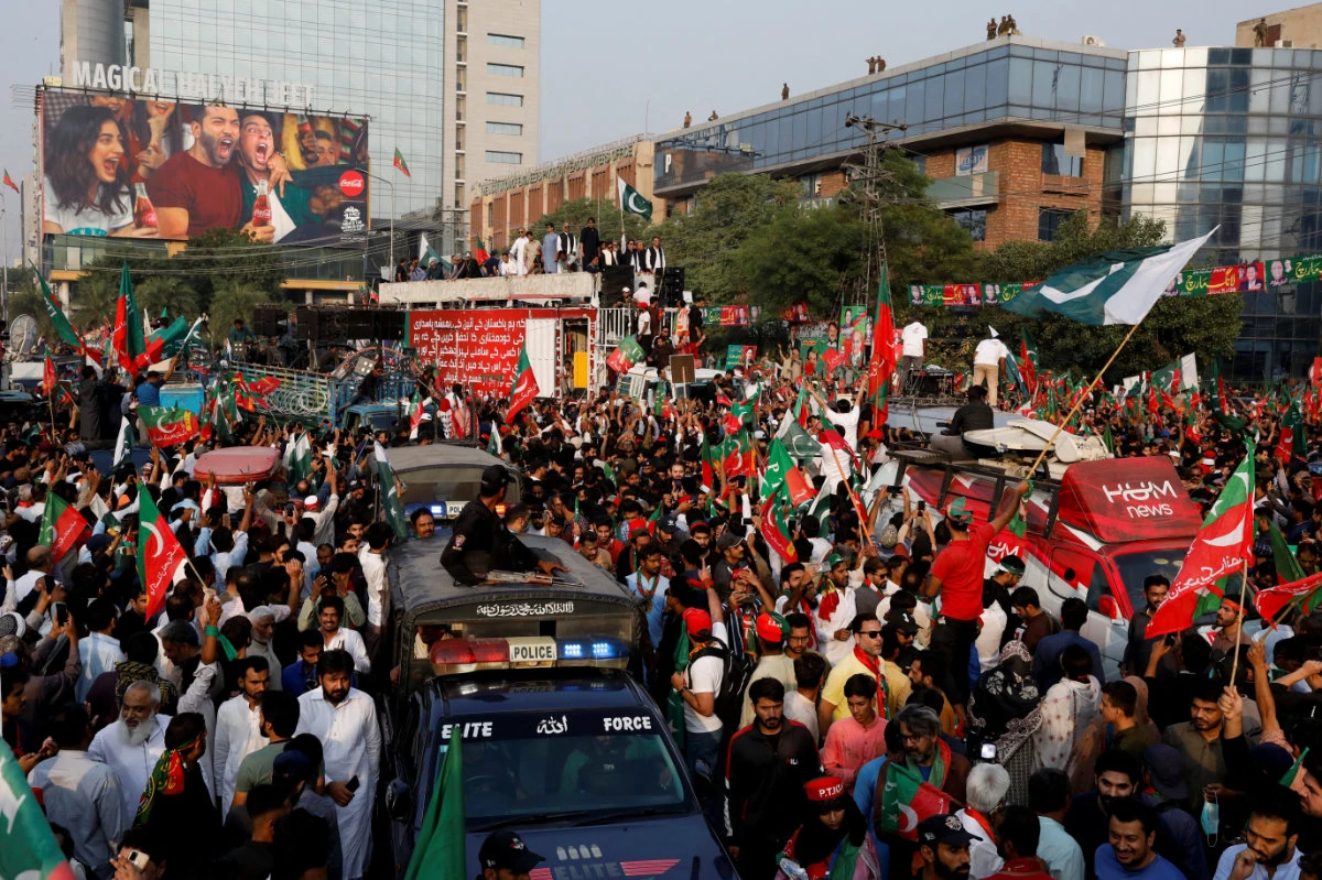 Supporters of Pakistan's former PM Imran Khan fill a major thoroughfare in Lahore city as they begin a march to Islamabad to demand new elections. (Reuters)