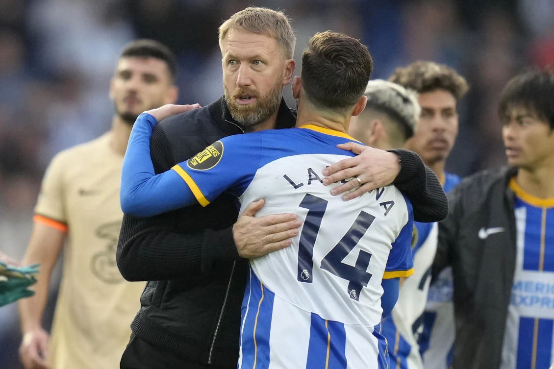 Chelsea’s head coach Graham Potter hugs Brighton’s Adam Lallana at the end of their Premier League match at the Amex stadium in Brighton on Saturday. (AP)