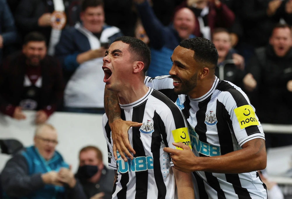 Newcastle United's Miguel Almiron celebrates scoring their fourth goal with teammate Callum Wilson. (Action Images/Reuters)