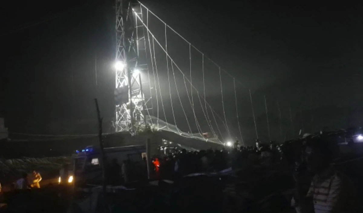 Rescuers work at night after a cable bridge across the Machchu river collapsed in Morbi district, western Gujarat state, India, Sunday, Oct.30, 2022. (AP)