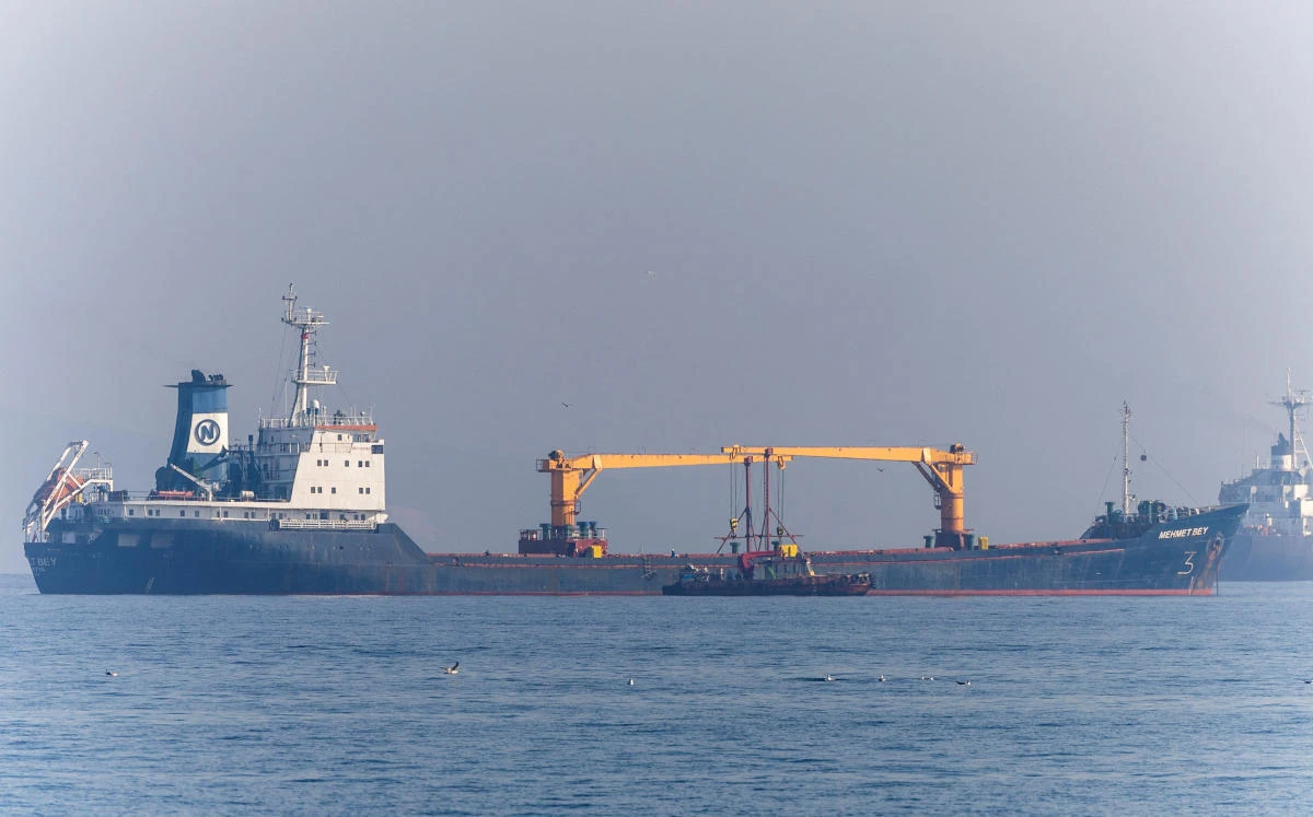 Joint Coordination Centre officials board a cargo ship as it waits to pass the Bosphorus strait off the shores of Yenikapi in Istanbul, Turkiye, October 31, 2022. (Reuters)