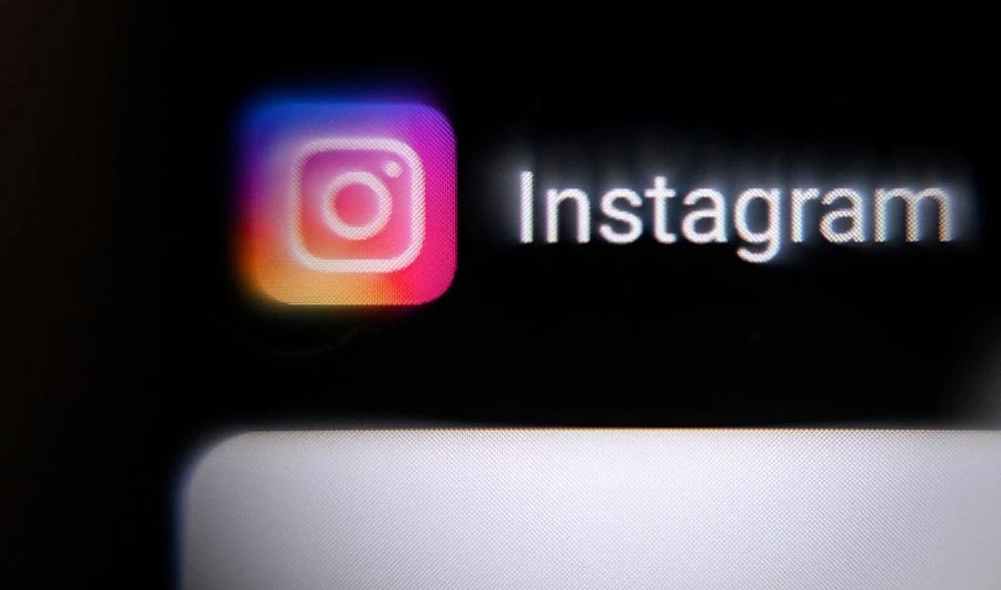 A photo taken on March 14, 2022, shows the US social network Instagram logo on a smartphone screen in Moscow. (AFP/FILE)