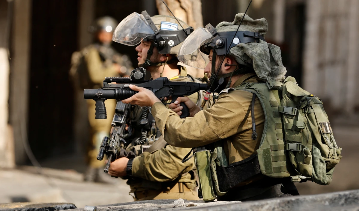 Israeli forces clash with Palestinians during a protest in Hebron in the Israeli-occupied West Bank on October 28, 2022. (Reuters)