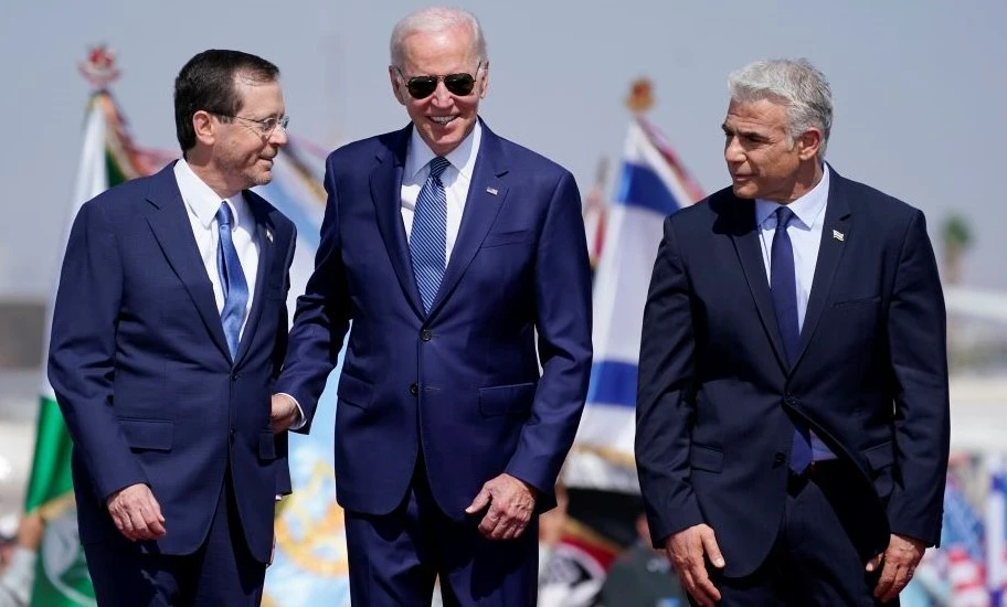 Joe Biden, center, Yair Lapid, right, and Israeli President Isaac Herzog at Ben Gurion Airport, Lod, July 13, 2022. (AP Photo)
