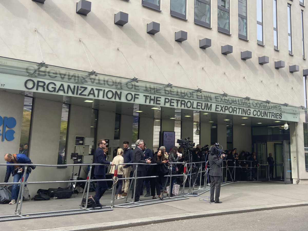 People and media gather at the entrance of the OPEC building in Vienna, Austria on Oct. 5, 2022. (AP File)