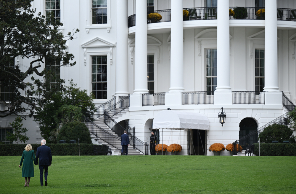 US President Joe Biden and US First Lady Jill Biden walk on the South Lawn of the White House in Washington. (AFP)