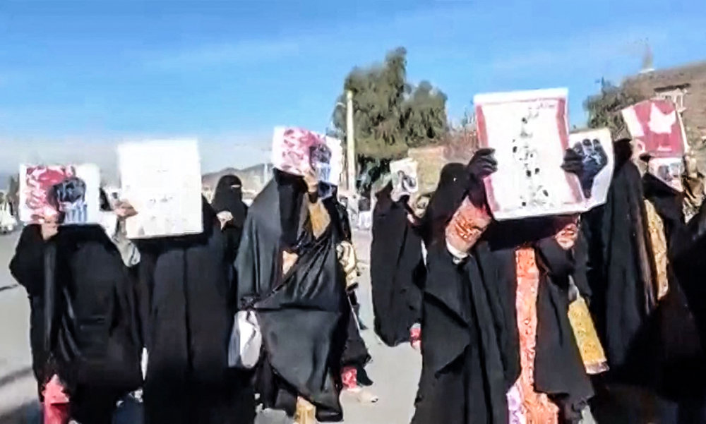 Women marching with anti-regime placards in the city of Zahedan in Iran’s Sistan-Baluchistan province. (AFP)