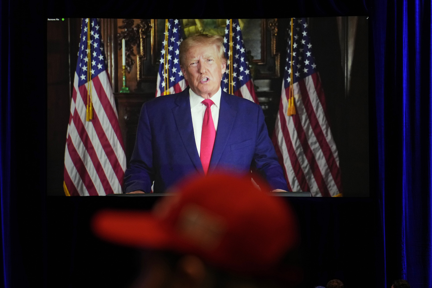 People listen as former President Donald Trump speaks to an annual leadership meeting of the Republican Jewish Coalition. (AP)
